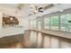 Bright living room open to the kitchen with hardwood floors and a coffered ceiling at 550 Constellation Overlook Sw, Atlanta, GA 30331