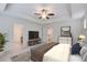 Bedroom with ceiling fan, TV, dresser, and a view of the ensuite bathroom at 550 Constellation Overlook Sw, Atlanta, GA 30331