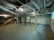 Unfinished basement space with exposed ceiling beams, ductwork, support pillars, and concrete floor at 6106 Oak Hill Sw Dr, Austell, GA 30168