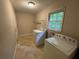 Well-lit laundry room with modern appliances for efficient chore management at 6106 Oak Hill Sw Dr, Austell, GA 30168