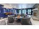 Spacious basement area with chairs, a stone fireplace, and a bar at 70 Finch Forest Trl, Atlanta, GA 30327