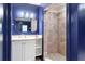 Bathroom features a sink, and a tiled shower with stone base at 70 Finch Forest Trl, Atlanta, GA 30327