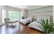 Bright bedroom featuring hardwood floors, two beds, large windows, and stylish decor at 70 Finch Forest Trl, Atlanta, GA 30327