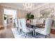 Elegant dining room with stylish chandelier, decorative mirror, and comfortable seating at 70 Finch Forest Trl, Atlanta, GA 30327
