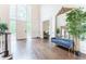 Grand foyer with high ceilings, large windows, statement mirror, and bench seating at 70 Finch Forest Trl, Atlanta, GA 30327
