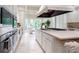Bright kitchen with stainless appliances, large island, and seating facing garden views at 70 Finch Forest Trl, Atlanta, GA 30327