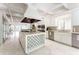 Open kitchen featuring a large island with wine rack, stainless appliances, and tile floors at 70 Finch Forest Trl, Atlanta, GA 30327