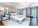 Luxurious main bedroom with elegant decor, a chandelier, and mirrored furniture at 70 Finch Forest Trl, Atlanta, GA 30327