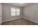 Comfortable bedroom with neutral carpet and paint, with natural light from a window at 10 Briarcliff Pl, Stockbridge, GA 30281