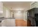 Kitchen and dining area, including a view to the adjacent dining room at 10 Briarcliff Pl, Stockbridge, GA 30281