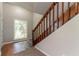 Entryway showcasing a staircase with wooden railings, durable flooring, and natural light at 10 Briarcliff Pl, Stockbridge, GA 30281