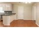 Bright kitchen features white cabinets, a breakfast bar, and stainless steel appliances at 10 Briarcliff Pl, Stockbridge, GA 30281