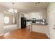 Open kitchen and dining area, featuring white cabinets and modern appliances at 10 Briarcliff Pl, Stockbridge, GA 30281