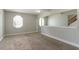 Living area with plush neutral carpet and trim, with lots of natural light at 10 Briarcliff Pl, Stockbridge, GA 30281