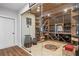 A custom wine cellar features wooden racks and storage for an extensive collection of wine at 120 Nezhat Pl, Sandy Springs, GA 30350