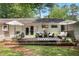 Charming backyard deck with comfortable seating, outdoor decor, and lush greenery at 3357 Pretty Branch Se Dr, Smyrna, GA 30080