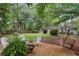 Serene backyard with a fire pit, swing, and cozy seating area, perfect for relaxation at 3357 Pretty Branch Se Dr, Smyrna, GA 30080