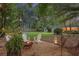 Inviting backyard with a fire pit, swing, and mature trees, ideal for relaxing and enjoying nature at 3357 Pretty Branch Se Dr, Smyrna, GA 30080