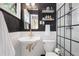 Modern bathroom featuring subway tiles, black accents, and stylish fixtures at 3357 Pretty Branch Se Dr, Smyrna, GA 30080