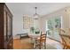 Charming dining area with white paneling, bright lighting, and access to the backyard through French doors at 3357 Pretty Branch Se Dr, Smyrna, GA 30080