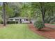 Well-maintained one-story home surrounded by lush greenery and a neatly landscaped yard at 3357 Pretty Branch Se Dr, Smyrna, GA 30080