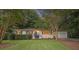 Charming one-story home with a well-manicured front yard and a quaint walkway leading to the front door at 3357 Pretty Branch Se Dr, Smyrna, GA 30080