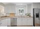 Functional kitchen featuring granite countertops, stainless steel appliances, and classic white cabinetry at 3357 Pretty Branch Se Dr, Smyrna, GA 30080