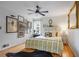 Bright bedroom with hardwood floors, ceiling fan, and decoratively adorned walls at 3357 Pretty Branch Se Dr, Smyrna, GA 30080