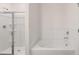 Bathroom showing walk-in shower and soaking tub at 580 Silver Moon Dr, Loganville, GA 30052