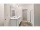 Bathroom with dual sinks, walk-in shower, and walk-in closet at 580 Silver Moon Dr, Loganville, GA 30052