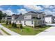View of a new home with sidewalk, lawn, and well-manicured landscaping at 580 Silver Moon Dr, Loganville, GA 30052