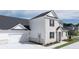 New construction home with 2-car garage, grass lawn and sidewalk at 580 Silver Moon Dr, Loganville, GA 30052