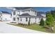 Exterior view of new construction home with grass lawn and sidewalk at 580 Silver Moon Dr, Loganville, GA 30052