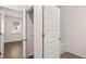 Hallway displaying access to a bathroom, closet, and bedroom at 580 Silver Moon Dr, Loganville, GA 30052
