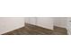 Hallway with luxury vinyl plank flooring and white trim at 580 Silver Moon Dr, Loganville, GA 30052