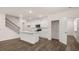 Open-concept kitchen and living room with an island and stairs in view at 580 Silver Moon Dr, Loganville, GA 30052