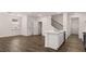Open-concept living room with an island and modern flooring at 580 Silver Moon Dr, Loganville, GA 30052
