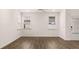 Open living room featuring hardwood floors and natural lighting at 580 Silver Moon Dr, Loganville, GA 30052