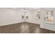 Empty living room with wood-look flooring, ceiling fan and glass patio door at 580 Silver Moon Dr, Loganville, GA 30052