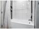 Beautiful tub and shower featuring white subway tile and dark fixtures at 955 Juniper Ne St # 3331, Atlanta, GA 30309