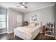 Bright, spacious bedroom with a cozy bed, ceiling fan, and ample storage space on decorative bookshelves at 955 Juniper Ne St # 3331, Atlanta, GA 30309