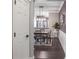 Hallway view to dining room features modern chandelier and wainscoting, enhancing the home's appeal at 955 Juniper Ne St # 3331, Atlanta, GA 30309