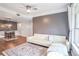 Cozy living room space with large windows, a comfortable white couch, and dark wood floors at 955 Juniper Ne St # 3331, Atlanta, GA 30309