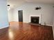 Spacious living room featuring a brick fireplace and ample natural light at 115 Bond Dr, Ellenwood, GA 30294
