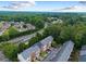 Overhead shot of townhomes with easy access to nearby highways and surrounded by lush trees at 5357 Beaver Br, Norcross, GA 30071
