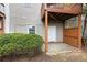 A serene backyard area with a privacy fence and a small door with access to additional storage at 5357 Beaver Br, Norcross, GA 30071