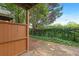 Secluded backyard area with a wood fence offering privacy and access to green space at 5357 Beaver Br, Norcross, GA 30071