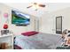Bedroom features a bed, ceiling fan, closet, and television at 5357 Beaver Br, Norcross, GA 30071
