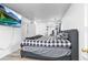 Bedroom with laminate wood flooring, window, TV, and bed at 5357 Beaver Br, Norcross, GA 30071