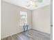 Empty bedroom features laminate flooring, a window, and neutral walls at 5357 Beaver Br, Norcross, GA 30071